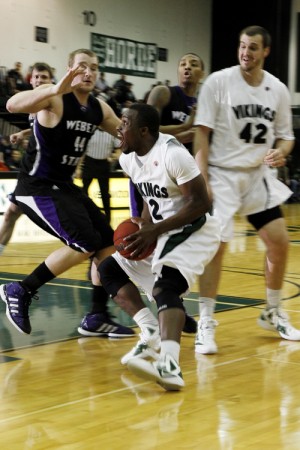 Odum on top: Charles Odum, leading scorer against Northern Colorado, charges the Weber State defense. Odum was named Big Sky conference player of the week after his performance against Northern Colorado.