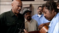 Hero’s song: Harry Belafonte, left, sings the blues with inmates in an L.A. jail.