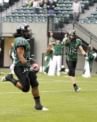 Coming into view: Portland State senior running back Willie Griffin (left, #20) runs downfield looking for an opening. 