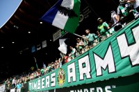 Army of fans: Legions of faithful Portland Timbers supporters show their love for the club. The Timbers sold out every game this year and have nearly renewed every season ticket for the 2012 campaign.