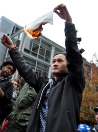 Bao Duong, a 24-year-old PSU graduate, burned a copy of his diploma yesterday at the Occupy PSU general assembly.