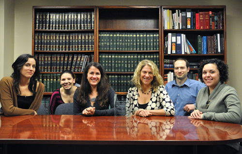 The Student Legal Services team from the right to left: Danielle Haro, Richard Myers, Lissa Kaufman, Amie Wexler, Maigan Wright and Katherine Kestell gather around their award.