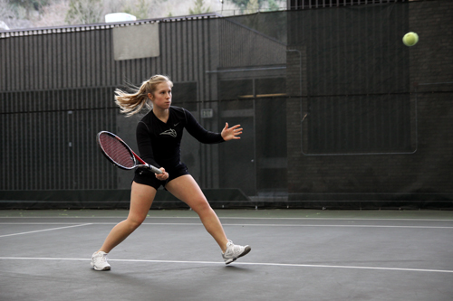  Hit-and-miss: Senior Marti Pellicano hits the practice court after a weekend of mixed results. Pellicano and partner Megan Gavi had the best doubles showing of the match against the Cougars but still fell short 8-3.