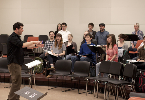 Ethan Sperry directs the PSU Chamber Choir. 