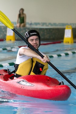 Pool perfect: Student Henrich Biore participates in the adaptive kayaking event. 