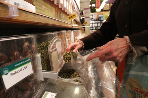 Buying bulk: A Whole Foods customer shops in the bulk foods section.