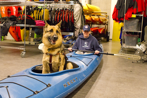 Unleashed: Jen Armbruster, Inclusive Rec and community service coordinator, poses in a kayak with her guide dog Vail.