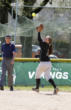 More hit than mitt: Freshman Alicia Fine reaches out to recieve a deep ball. Fine is a force at-bat, with the team’s second most hits and most RBIs.