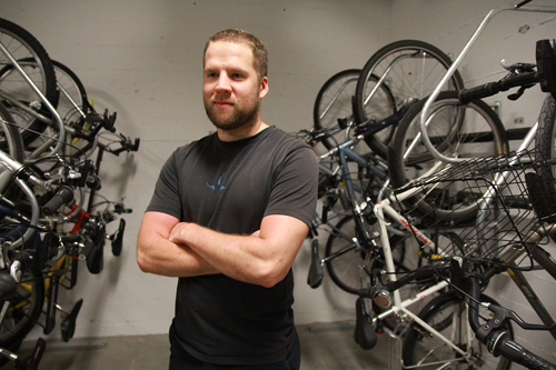 Putting the cycling in recycling: Rental coordinator Dan Penner holds court in the bike racks at PSU’s Bike Hub. All of the bikes used in the VikesBikes program were once abandoned on campus.