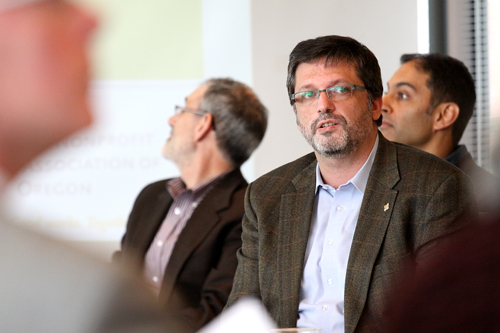 Andreas Schröer (center), a PSU professor and the principal investigator of the nonprofit report, presents the team’s research during the release event on May 1.