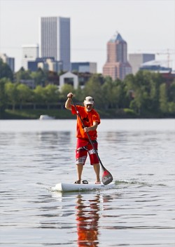 Afloat: Gorge Performace owner Bob Rueter goes for a paddle on the Willamette River. The next stand up Paddle race will begin at 10 a.m. on June 2. 