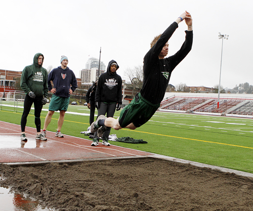 Jump for joy: Vikings practice long jumps on their training ground at Lincon High School. The men will be trying to improve on a disappointing result in the indoor season.