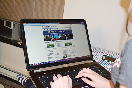 A PSU student fills out her FAFSA online. Waiting to apply for aid can mean less money for next year. Photo by Riza Liu.