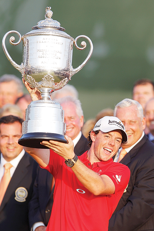 High profile: Rory McIlroy celebrates after winning the PGA Championship.  Photo © AP