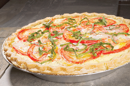Savory > Sweet: Switch up your standard pie filling by substituting the savory for the sweet. This tomato tart is a fresh, savory delight perfect for a potluck or a night inside. Photo by Karl Kuchs.