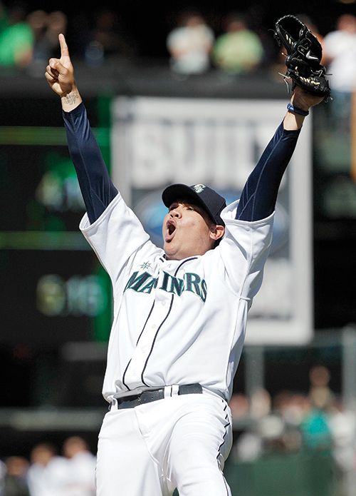 Felix Hernandez had reason to celebrate after signing a $175 million contract extension this week. Photo © Ted S. Warren/AP
