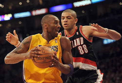 Nicolas Batum covers Kobe Bryant during the Blazers’ matchup with the Los Angeles Lakers on Sunday. The Lakers got 40 points from Bryant and came away with a 111-107 win. Photo by © Harry How.