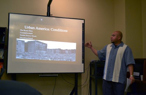 Jose Gutierrez, a guest speaker, talks about how Latinos influenced hip-hop at La Casa Latina on Wednesday. Photo by Riza Liu.