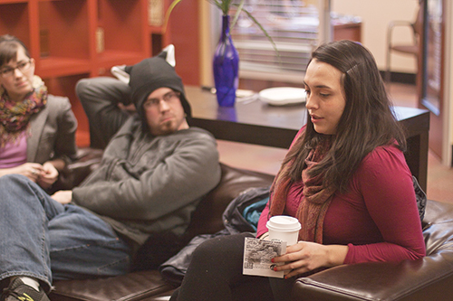 Adam Bird, left, a psychology major, and Maya Leon, a graphic design major, discuss varying philosophies at the interfaith coalition meeting. Photo by Miles Sanguinetti.