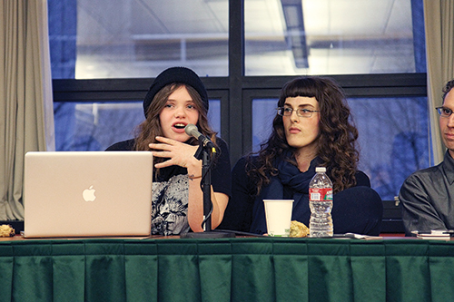 Genevieve Goffman of the Pink Tape Collective and Blazing Arrow, left, speaks while Meghan Keener of the transformative justice group Praxiss looks on. Photo by Kayla Nguyen.