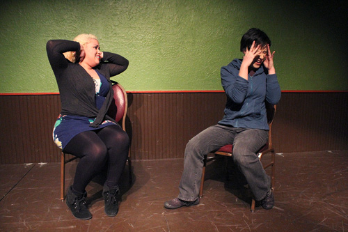Skootch over: Skootch ensemble members Wynee Hu and Fox Kimmons practice for their upcoming improv  performance at the Brody Theatre. Photo by Corinna Scott.
