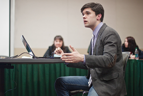 SFC Chair Nick Rowe presents proposed student-fee allocations to the senate on Feb. 20. Photo by Miles Sanguinetti.