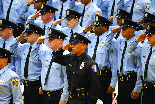 Daniel Woolridge, pictured in an all-black Temple University Campus Police uniform, is sworn in with other graduating officers in 2008. Photo by © Anna Zhilkova/ttn.