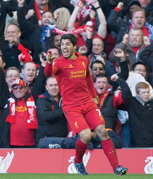 Luis Suarez sank his teeth into the competition but got off with a slap on the wrist. Photo © AP