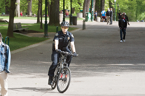 BRIAN ROMINGER, a CPSO officer, patrols by bike in the Park Blocks. More patrols will be conducted by bike this spring. Photo by Jinyi Qi.