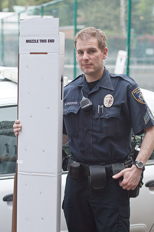 CPSO Patrol Sgt. Michael Anderson holds an evidence box built to house confiscated rifles. Photo by Miles Sanguinetti.