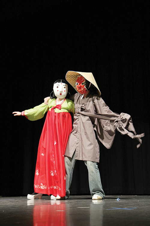 Mask-erade ball: Students from the Korean Student Association rehearse for their upcoming performance at this weekend’s Korea Night. Photo by Kayla Nguyen.