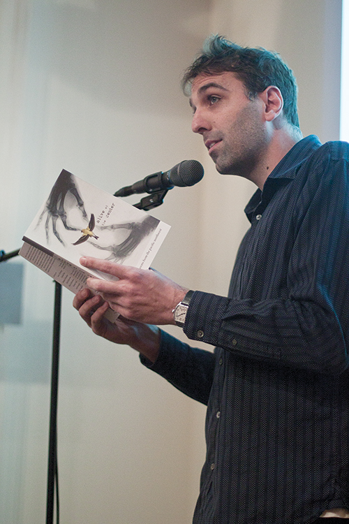 Poet Carl Adam Shick read at the book release party for Alive at the Center: Contemporary Poems from the Pacific Northwest. Photo by Miles Sanguinetti.