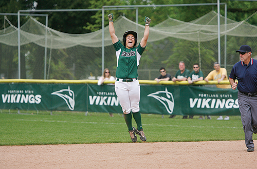 Becca Bliss celebrates after slamming a ninth-inning home run to give the Vikings the win on Senior Day. Photo by Karl Kuchs.