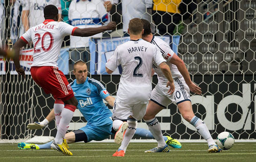 Jose Valencia, left, scores the tying goal against Vancouver in the 84th minute to salvage a draw for Portland. Photo © AP Photo/Thecanadian Press, darryl Dyck