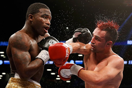 Adrien Broner,  left, faced a tough challenge against Paulie Malignaggi  but turned in a convincing performance in his welterweight debut.  © Nick Laham/ Golden Getty Images