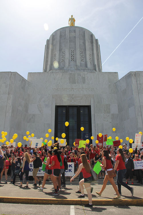 Oregon students swarm the steps of the Capitol in support of increased funding for education at a rally in Salem on April 25. Photo by Coby Hutzler.