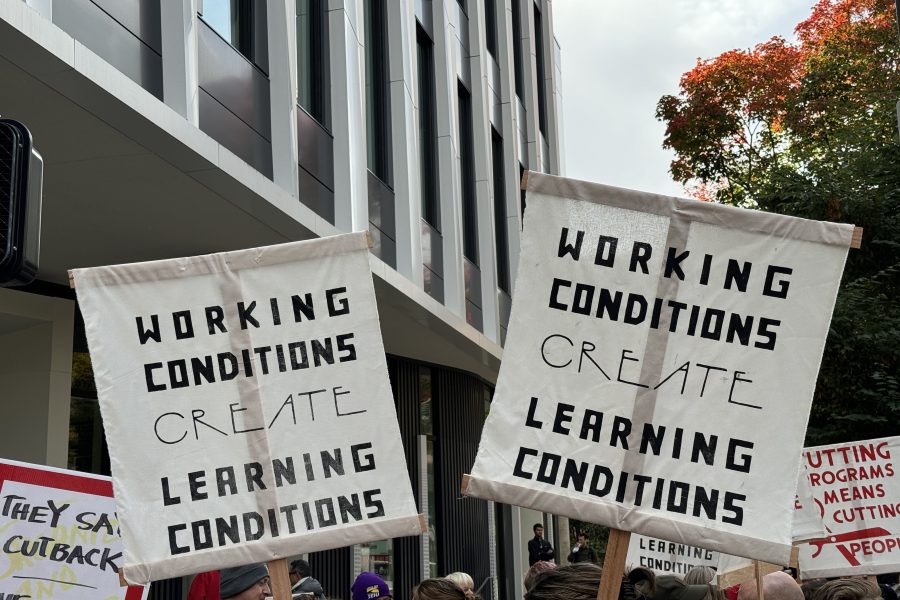 PSU-AAUP members wave picket signs with the slogan “Working conditions create learning conditions“ during a speak-out event.